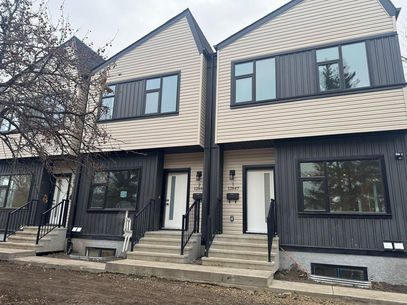 A newly built row of two-tone townhouses in north central Edmonton